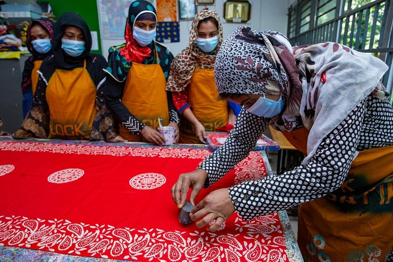 Women learn block batik to start their own business. 