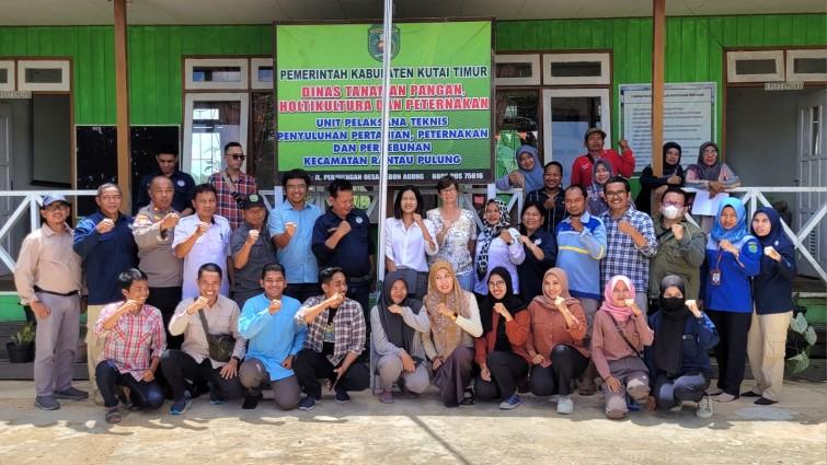 A group picture where everyone holds up a fist