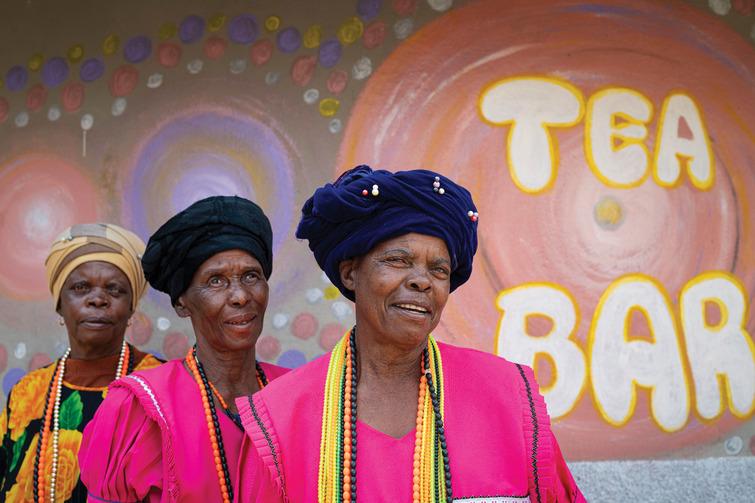 Picture of 3 women; text in the background saying: "Tea Bar"