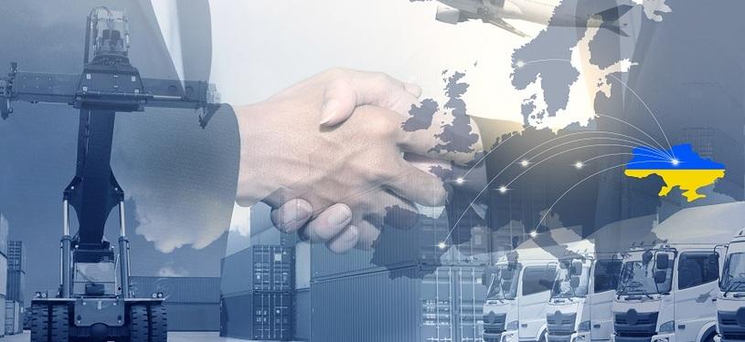 Multiple layered image with containers, loading crane with a Ukrainian flag in the shape of the country's outline, two hands shaking and trucks