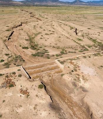 Aerial view of a river sill in the middle of the desert.