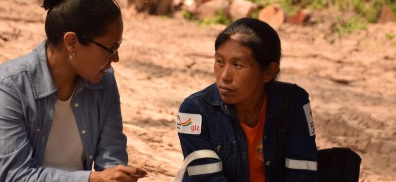 Two women are talking to each other.