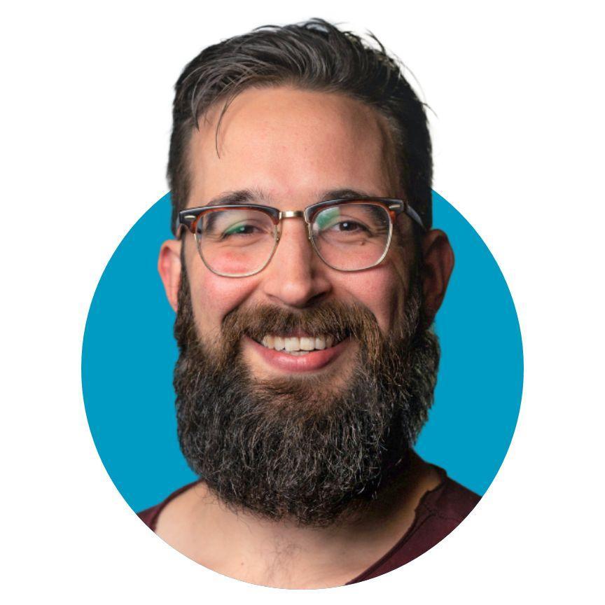 Man with beard and glasses in a blue circle