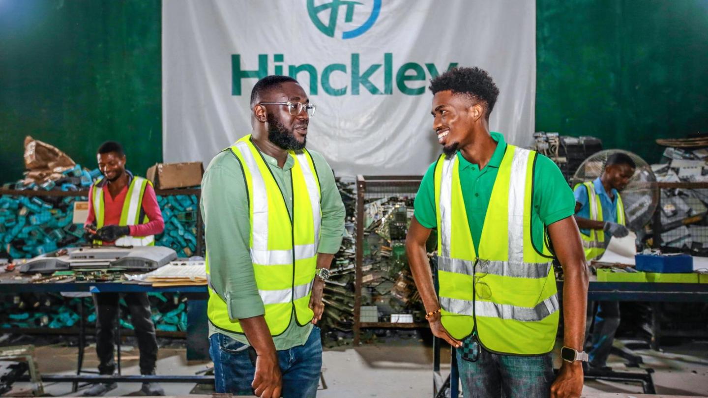 Two employees of a recycling company are talking.