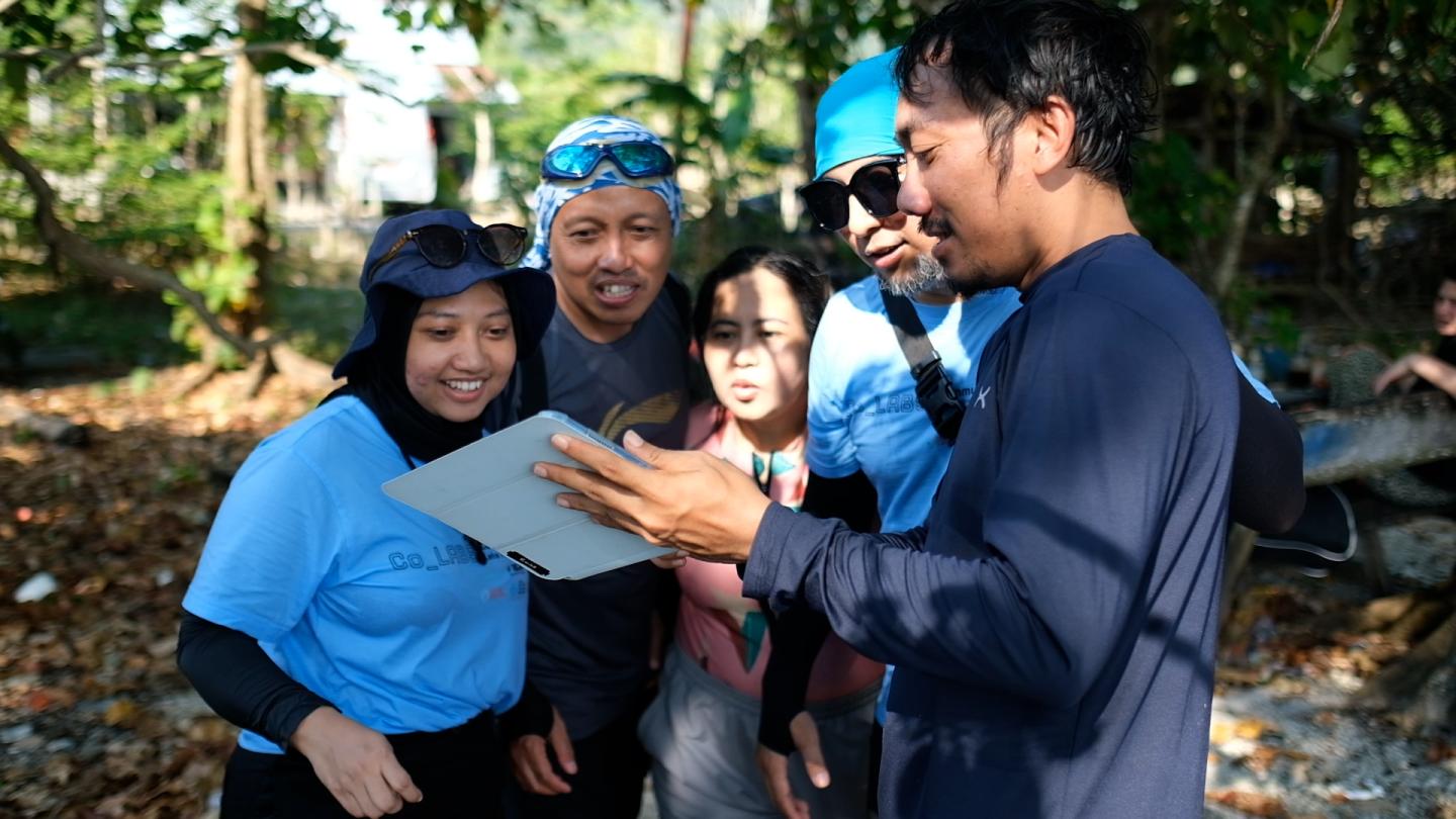 Group of people looking at a document together