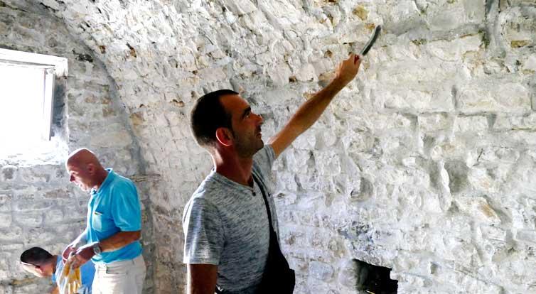 On the ground floor, stone masons are putting the final touches to the stone floor.
