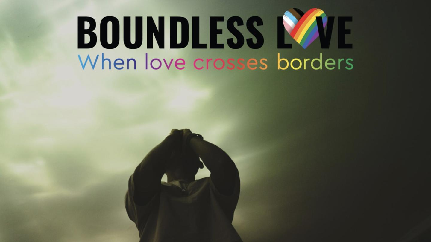 Silhouette of a praying person under a dramatic sky, with the text “Boundless Love – When love crosses borders” and a rainbow-colored heart.