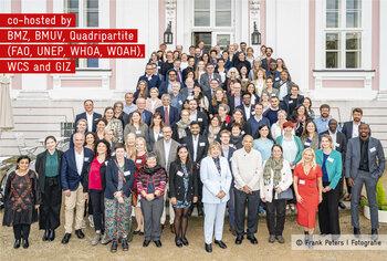 Participants of the Breaking Barrier event gather on a staircase for a photo.