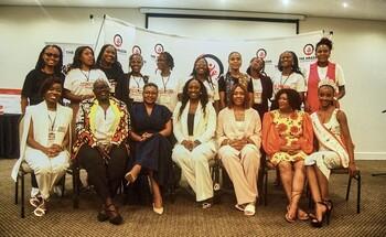 Several women pose for a group photo.