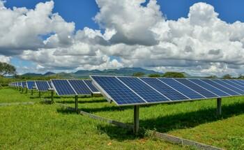 Several solar collectors in a field.