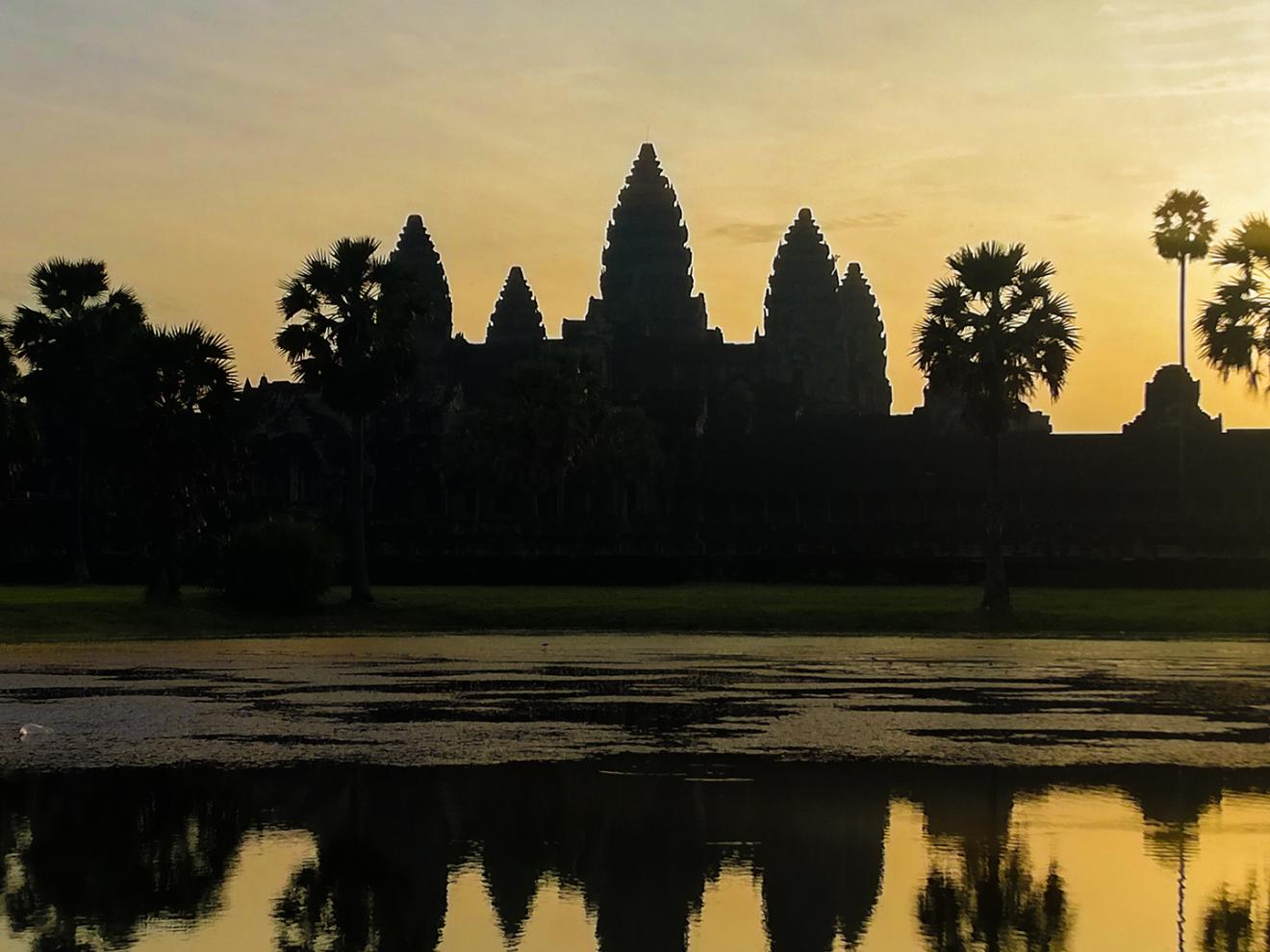 Silhouette of Angkor Temple in the evening light
