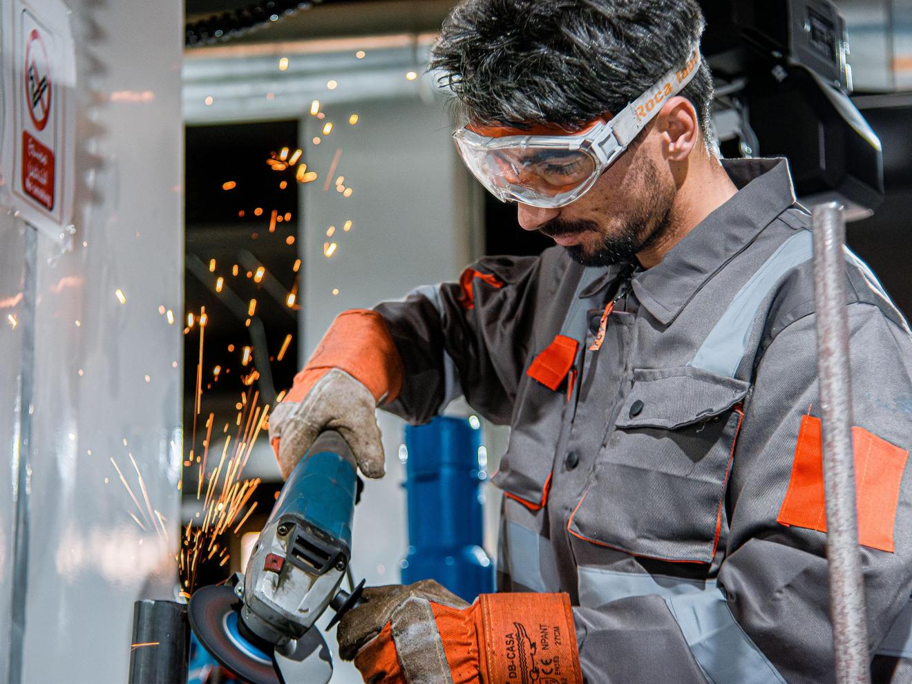 A man working with an angle grinder