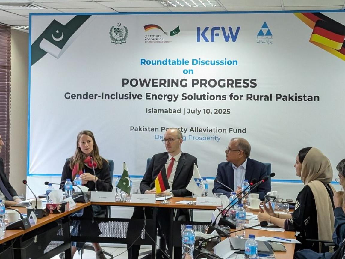 Participants sitting around the table at the roundtable discussion