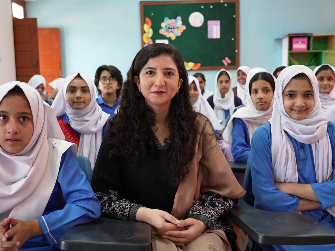 Young school girls pose for a group picture