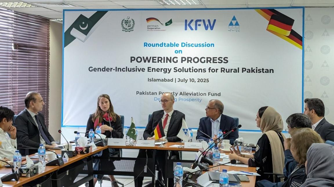Participants sitting around the table at the roundtable discussion