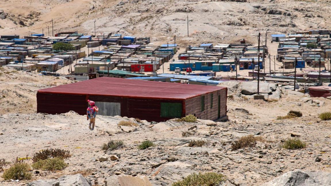 Several barracks in a desert-like location
