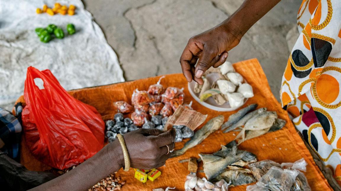 Buying spices at the market stall