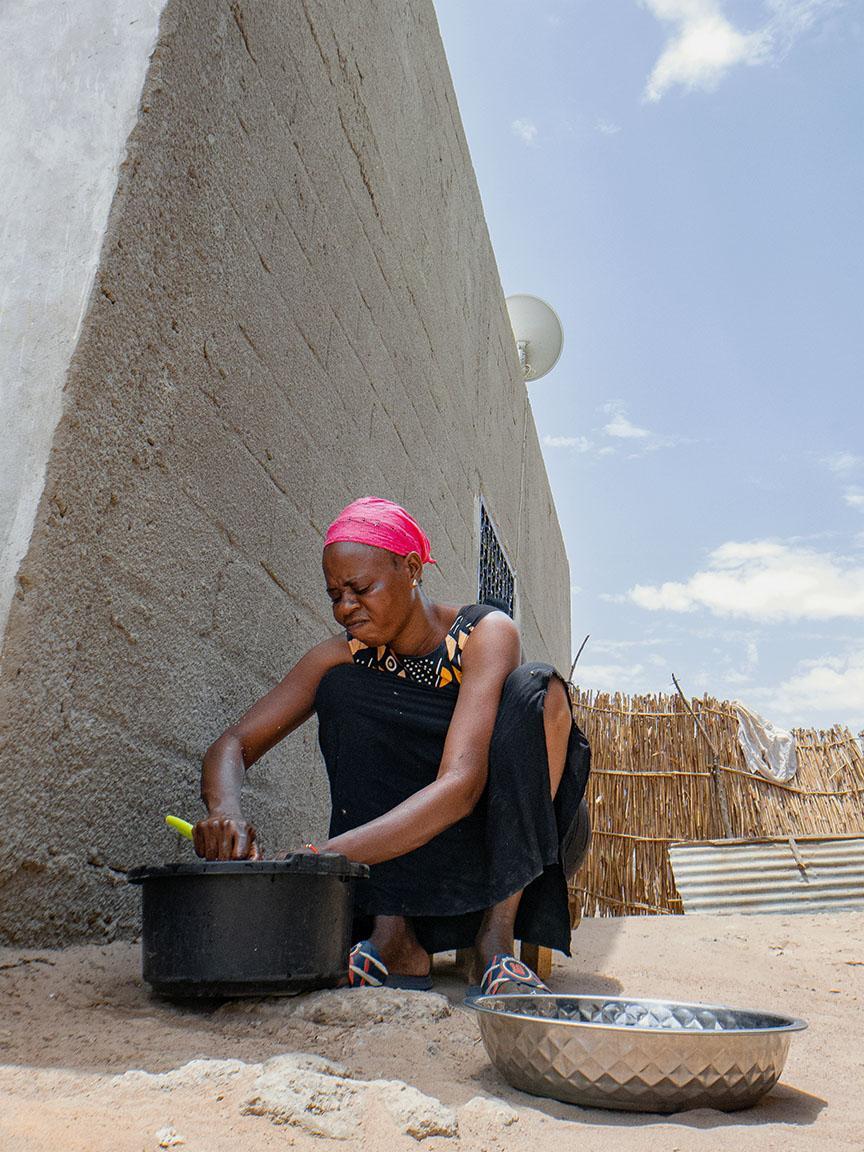 Woman cooking outside