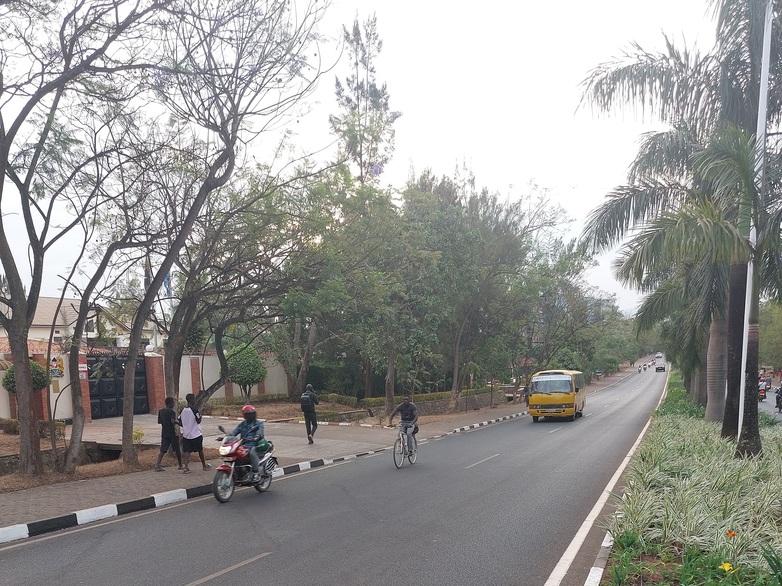 A road with people and bikes on it.