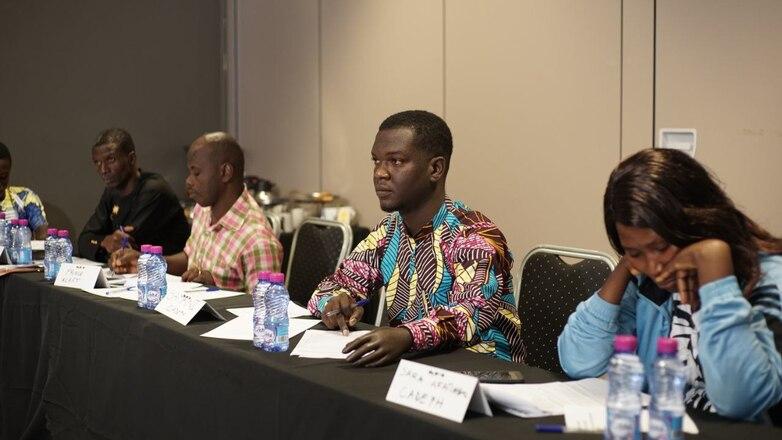 A conference participant wears a prosthetic hand.