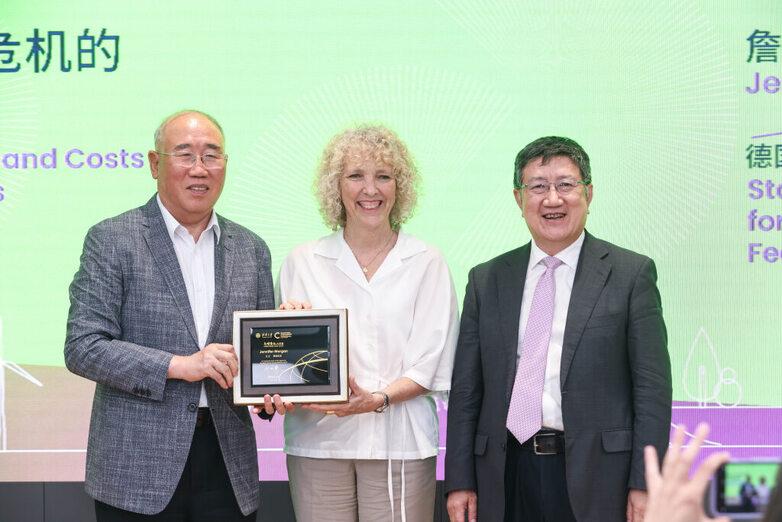 Jennifer Morgan with two representatives at Tsinghua University in Beijing
