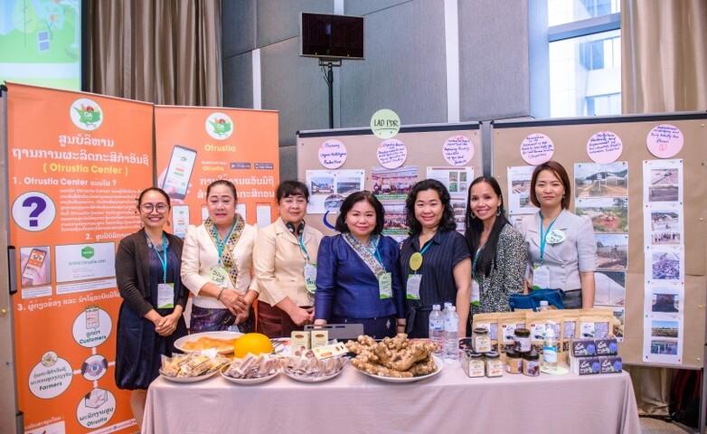 A group of women showcasing the agriculture products.