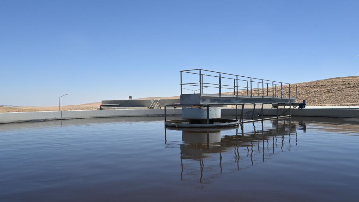 A large water treatment plant with a ladder.