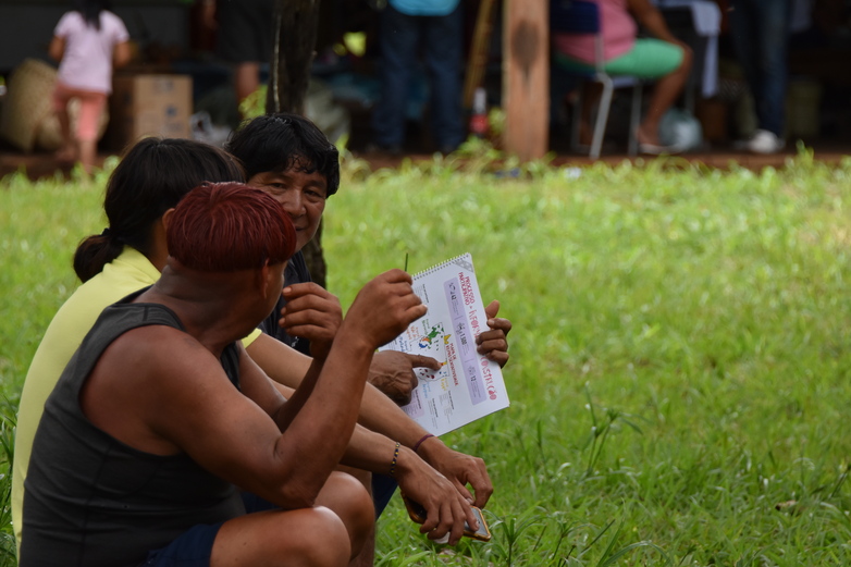 Members of the indigenous community sitting together for a consultation.