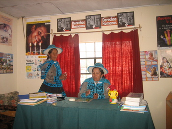 Two Peruvian women work in an office for human rights.