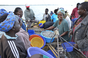 Female fishers working on a boat.