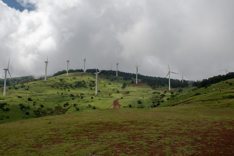 Wind turbines on a hill.