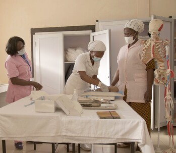 Three women in a training on neonatal resuscitation. 