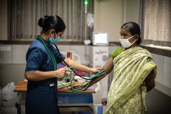 A nurse from a PMJAY empanelled hospital was taking the vitals of a beneficiary who had come for a treatment.