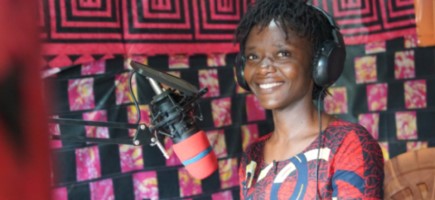 Journalist Salome Mugaza presenting the news at Kalehe Territorial Community Radio’s studio.