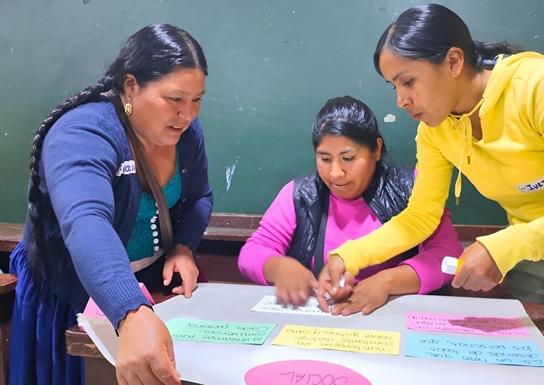 Three teachers from schools in city suburbs designing a poster on subjects like gender, diversity and human rights.