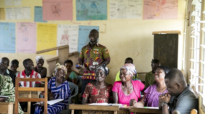 Cocoa farmers in a classroom taking part in a training session.