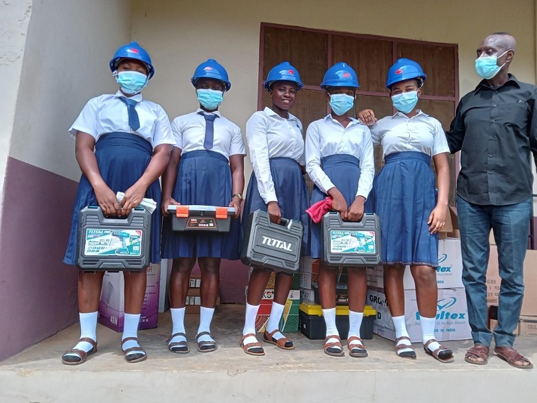 Several people holding toolboxes.