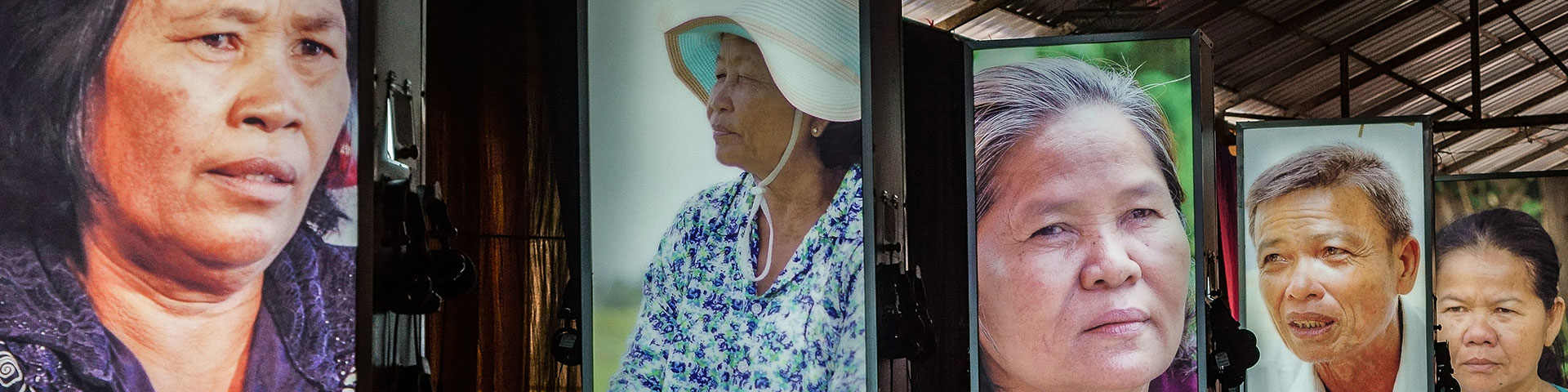 An exhibition on forced marriages shows large portraits of affected people.