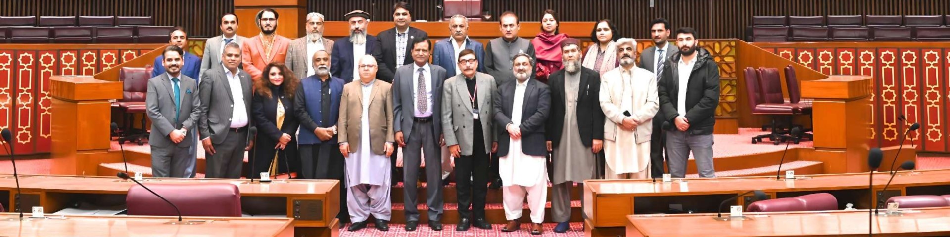 Members from the Provincial Assemblies of Pakistan visit the Senate and National Assembly during a parliamentary interface, posing for a group photo in the assembly hall.