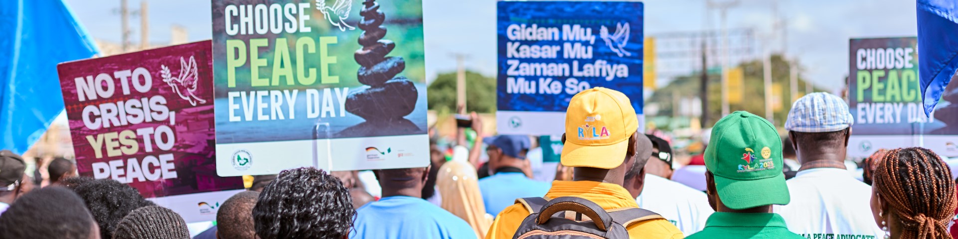 People holding peace placards during a peace walk in Plateau State, Nigeria.