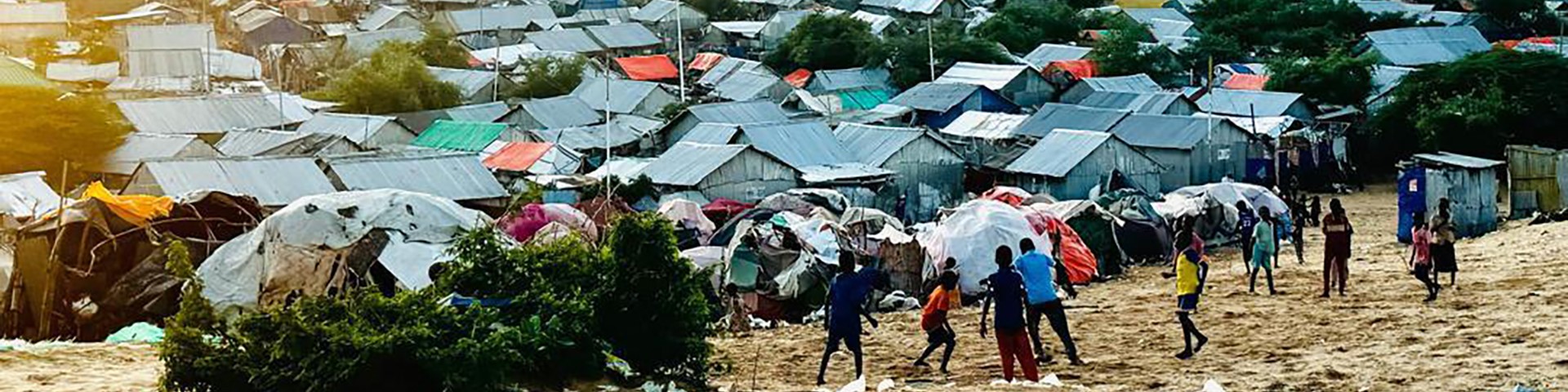 Children playing on the edge of a settlement of displaced persons in Kismayo, Somalia.