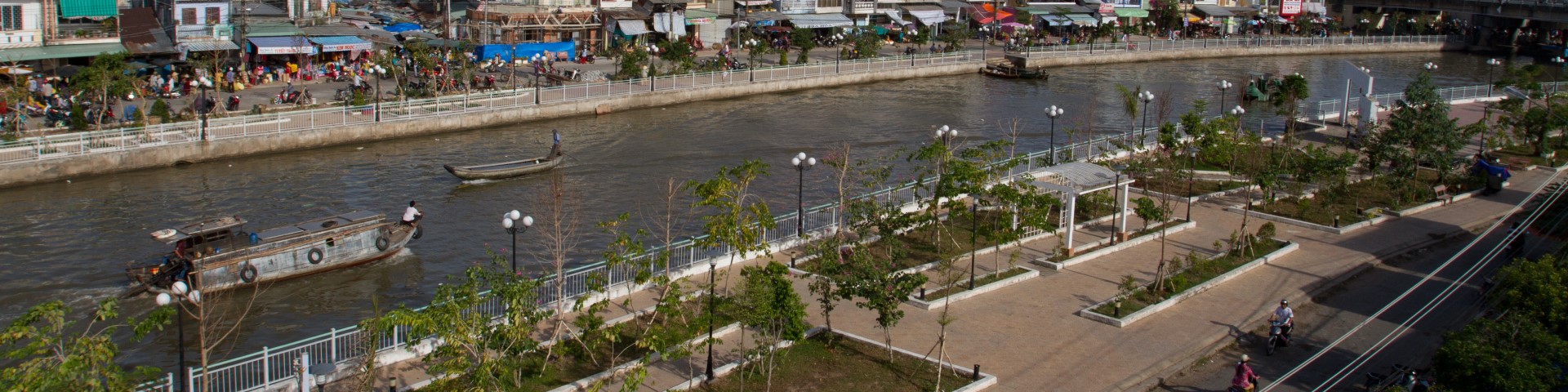 Aerial view of an urban canal in Ca Mau into which drainage systems have been integrated