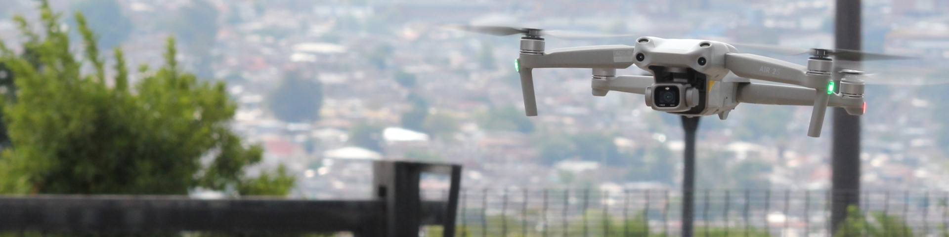 A camera drone outside a large city.