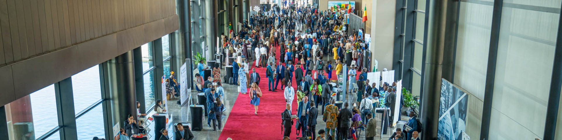 Participants stand in the foyer of the EITI Global Conference in Dakar, Senegal.