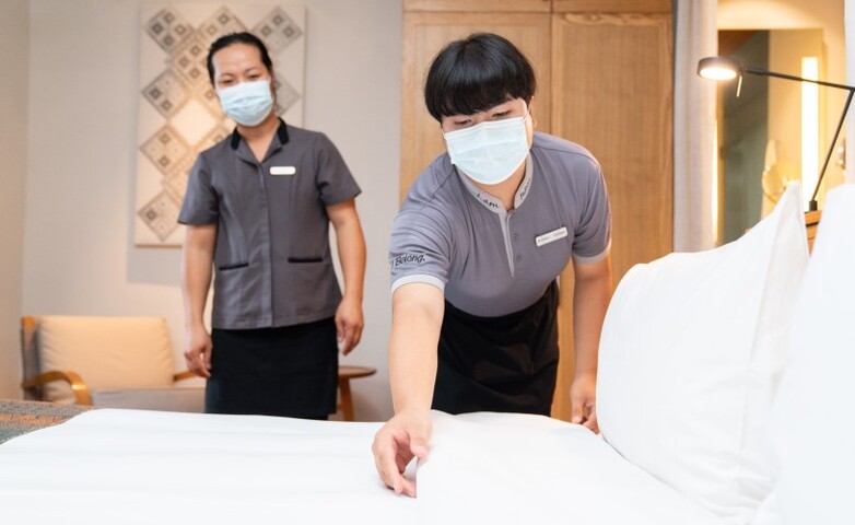 An in-company trainer supervises students while they practice in the Hotel Operation Professional course.