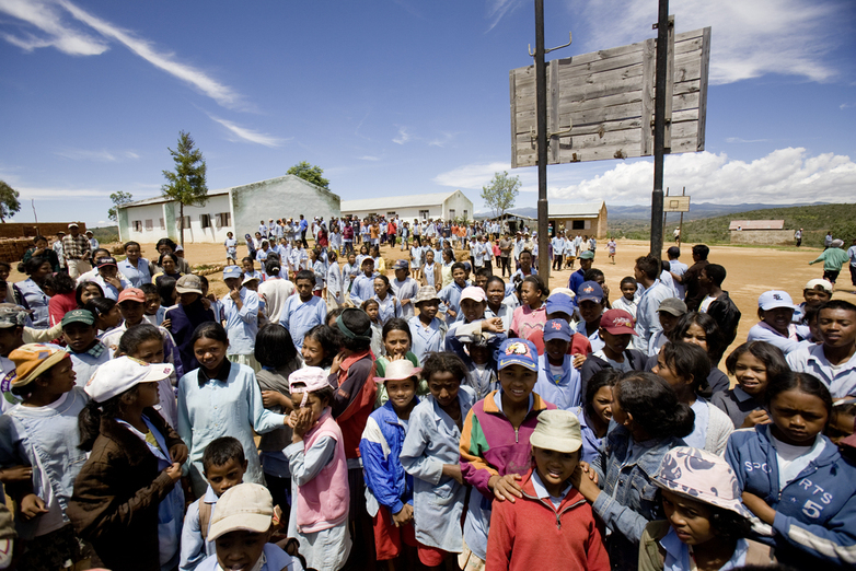 People are gathered at a village square.