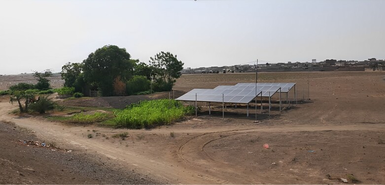 Solar panels in a meadow.