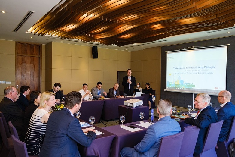 Several representatives from the private sector sitting at conference tables and engaging in discussion at the Green Economy Forum and Exhibition (GEFE) in 2022.