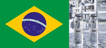 The left half of the picture shows the Brazilian flag, while on the right are two small bottles labelled ‘SAF’ against a blurred industrial background.