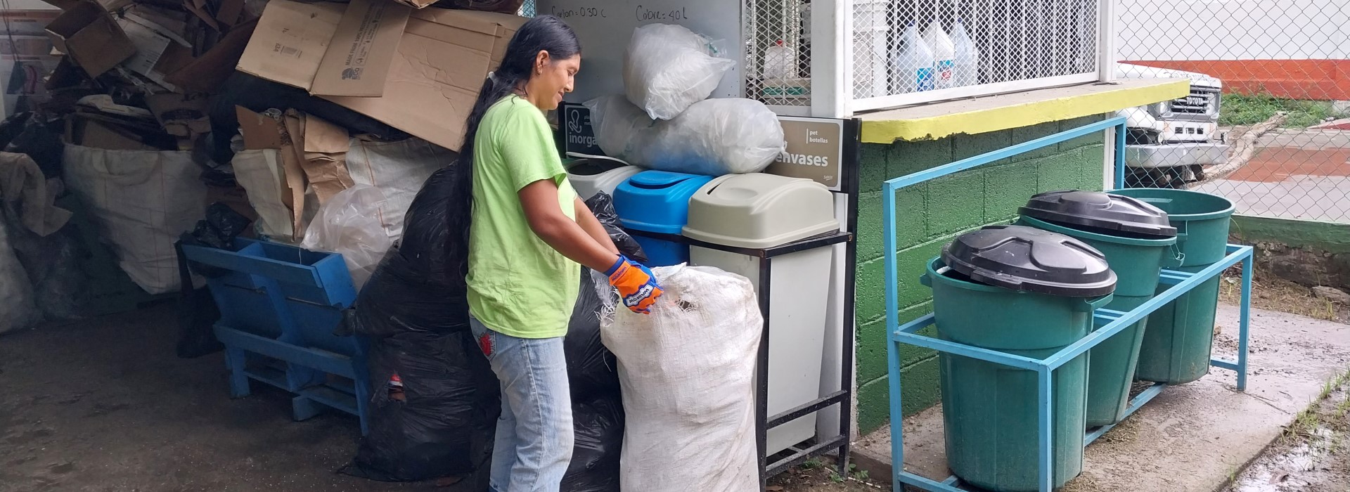 A woman sorts garbage